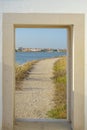 door to the street with dirt path in an idyllic setting promoting freedom