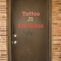 Door to tattoo parlor. Royalty Free Stock Photo