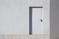 Door on the white building facade in the street Royalty Free Stock Photo