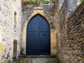 Door wooden blue arch ancient home access of city house street facade vintage city medieaval Royalty Free Stock Photo