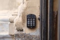 Doorbell button panel and intercom. Royalty Free Stock Photo