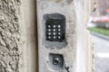 Doorbell button panel and intercom. Royalty Free Stock Photo