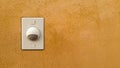 Doorbell or buzzer on mounted on wall