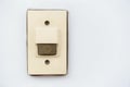 Doorbell or buzzer on white concrete wall