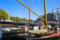 View on old sail ship deck with typical dutch inland canal harbor against blue summer sky