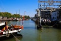 View on typical dutch inland water canal harbor against blue summer sky