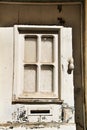 Doorknocker with hand shape on old wooden door