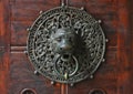 Doorknocker with head of lion.