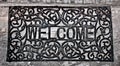 The Doormat curved steel of welcome text Royalty Free Stock Photo