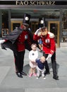 A doormen dressed as a toy soldier stand outside newly reopened the FAO Schwarz flagship store at Rockefeller Plaza