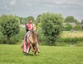 Man on horseback in medieval costume