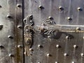 Doors to castle, an iron handle on a historic door, Pezinok, Slovakia