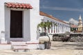 Doors, tree, cannon, clock tower and wall Baluarte de San Ignacio Cartagena