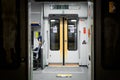 Doors of wagon in railway station of Milan, electric train carriage interior with an open sliding mechanical door. Milan Royalty Free Stock Photo