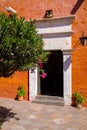 Doorway in a colourful red wall