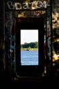 A doorway through graffiti cover columns Royalty Free Stock Photo