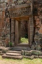 Doorway to stone temple with decorated pediment