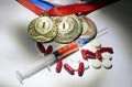 Doping in sport concept. Drugs and medals on black background.