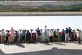 Dora Observatory, DMZ, South Korea - September 8 2017: Tourists watching with binoculars to North Korean village Propaganda villag