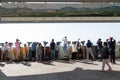 Dora Observatory, DMZ, South Korea - September 8 2017: Tourists watching with binoculars to North Korean village Propaganda villag