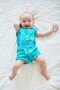 Dorable baby girl lying on bed in nursery Royalty Free Stock Photo