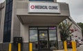 View of a medical sign and entrance with a neon OPEN sign