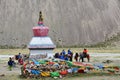 Dorchen, Tibet, China, June, 18, 2018. Pilgrims near the white Buddhist stupa at the beginning of the Cora around Kailas