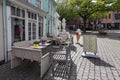 Dordrecht, Netherlands, May 8, 2019 A picturesque square, on the left a light green house with a patisserie and in front of it is