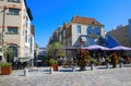 View over square on hoppe genever cafe restaurant with people sitting exterior in summer Royalty Free Stock Photo