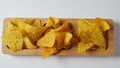 Doritos is an American brand of flavored tortilla chips. Corn chips doritos spiced on a a wooden board Royalty Free Stock Photo