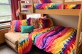 dorm room bunk beds made up with colorful bedding Royalty Free Stock Photo