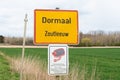 Dormaal, Flemish Brabant, Belgium Sign of the Village Dormaal with a CCTV security warning sign