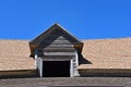 Dormer with old weathered wood and modern shingles Royalty Free Stock Photo