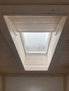 Dormer window framed with wooden panels. Roof windows. Royalty Free Stock Photo