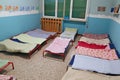 Dormitory with beds for children in the early childhood school