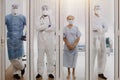 4 of Dortor, Nurse and patient looking out in the quarantine room