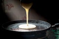 Dosa batter poured on a tawa Royalty Free Stock Photo