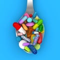 Dose of colorful pills in spoon Royalty Free Stock Photo