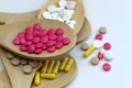 Wooden spoons with medicines lie on top of each other