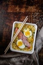 Doshirak fast food. Instant noodles with egg, sausages and spices. Homemade ramen. Traditional Chinese food. Top view Royalty Free Stock Photo