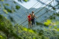 Dossena Italy 2022 Iron sun bridge suspended in the void to cross the valley on foot Royalty Free Stock Photo