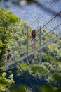 Dossena Italy 2022 Iron sun bridge suspended in the void to cross the valley on foot Royalty Free Stock Photo