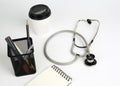 Dostor's working table,stethoscope on white