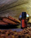 Doterra essential oils. for protective oil. Against the background of coffee beans and cinnamon sticks.medicinal vials.