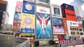 Dotonbori Glico Sign during a day in Osaka, Japan. Huge Japanese ads.