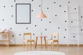 Dots wallpaper and wooden furniture Royalty Free Stock Photo