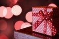 Dotted Christmas present on the blurred lights background Royalty Free Stock Photo