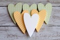 Dotted pale green hearts on wooden background Royalty Free Stock Photo