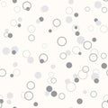 Messy gray dots and rings on white background. Colorful festive seamless pattern with round shapes. Royalty Free Stock Photo