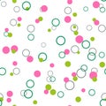 Messy green, pink dots and rings on white background. Colorful spring seamless pattern with round shapes. Royalty Free Stock Photo